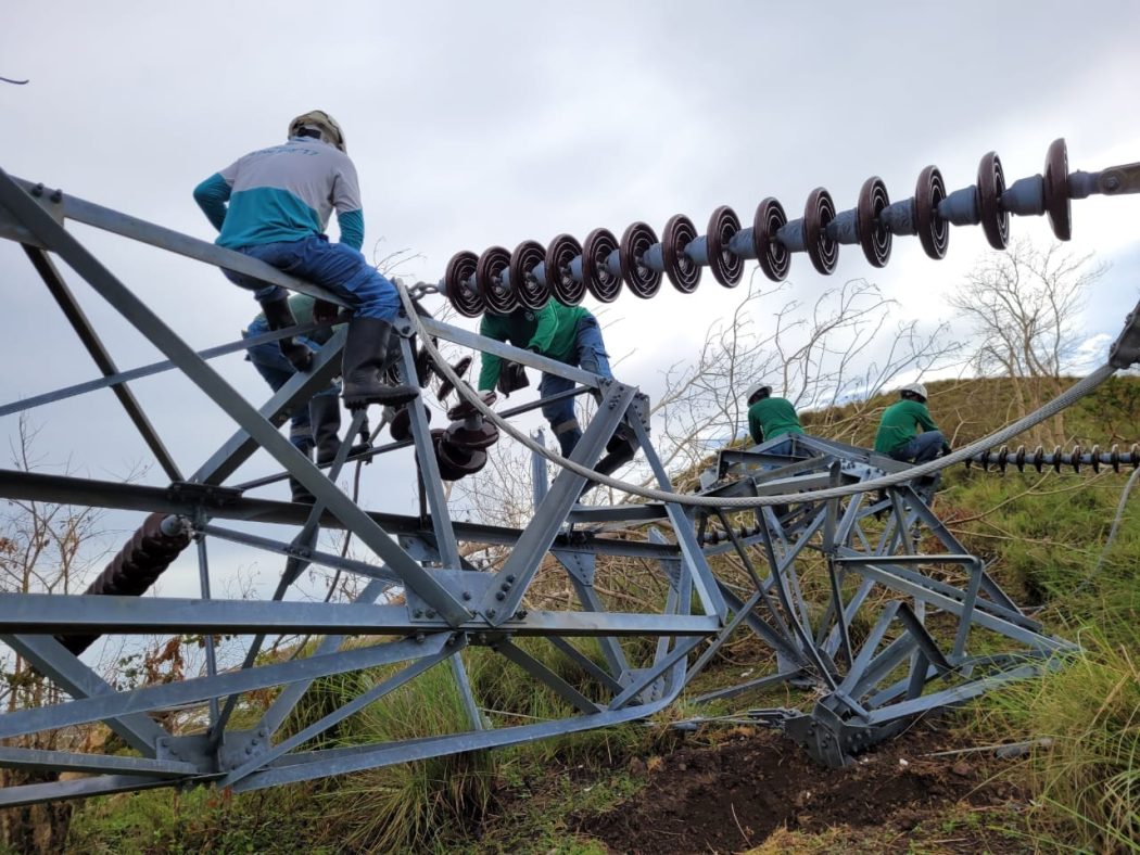 NGCP linemen fixing toppled tower
